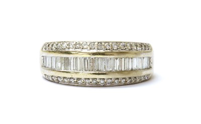 Lot 78 - An 18ct white gold three row diamond set half hoop ring