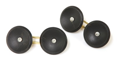 Lot 177 - A pair of Continental diamond and onyx cufflinks, c.1925