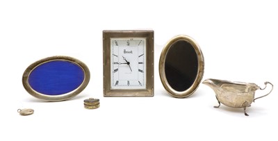 Lot 24 - A silver cased Harrods boudoir clock