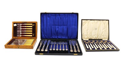 Lot 23 - A cased set of twelve Continental silver hors d'ourves forks