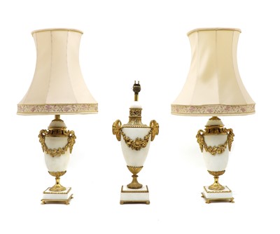 Lot 200 - A pair of Classical style white marble and gilt metal urn form table lamps
