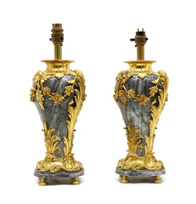 Lot 96 - A pair of grey marble and ormolu table lamps of vase form