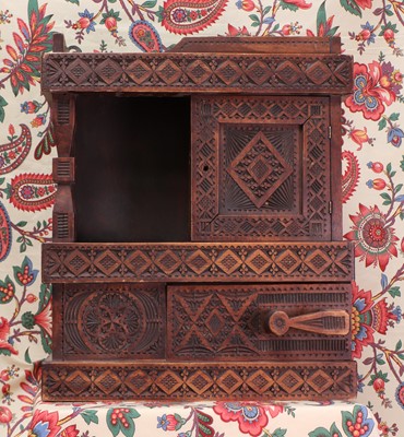 Lot 34 - A chip-carved wooden wall-hanging cabinet