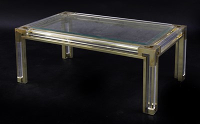 Lot 718 - A Lucite and brass coffee table