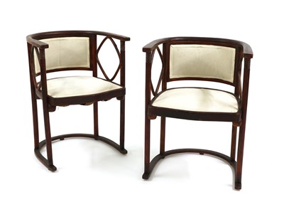 Lot 9 - A pair of Viennese Secessionist 'Fledermaus' armchairs