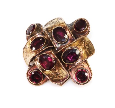 Lot 57 - A Victorian garnet set ribbon style knot brooch