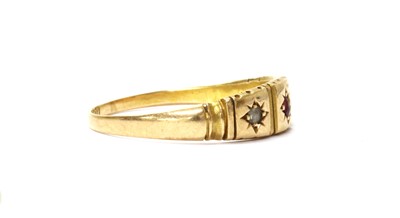 Lot 9 - A 15ct gold ruby and diamond three stone ring