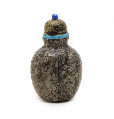 Lot 146 - A Chinese crinoid marble snuff bottle