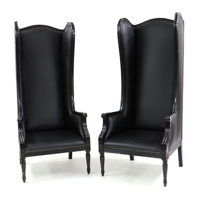 Lot 490 - A pair of contemporary high backed wing chairs