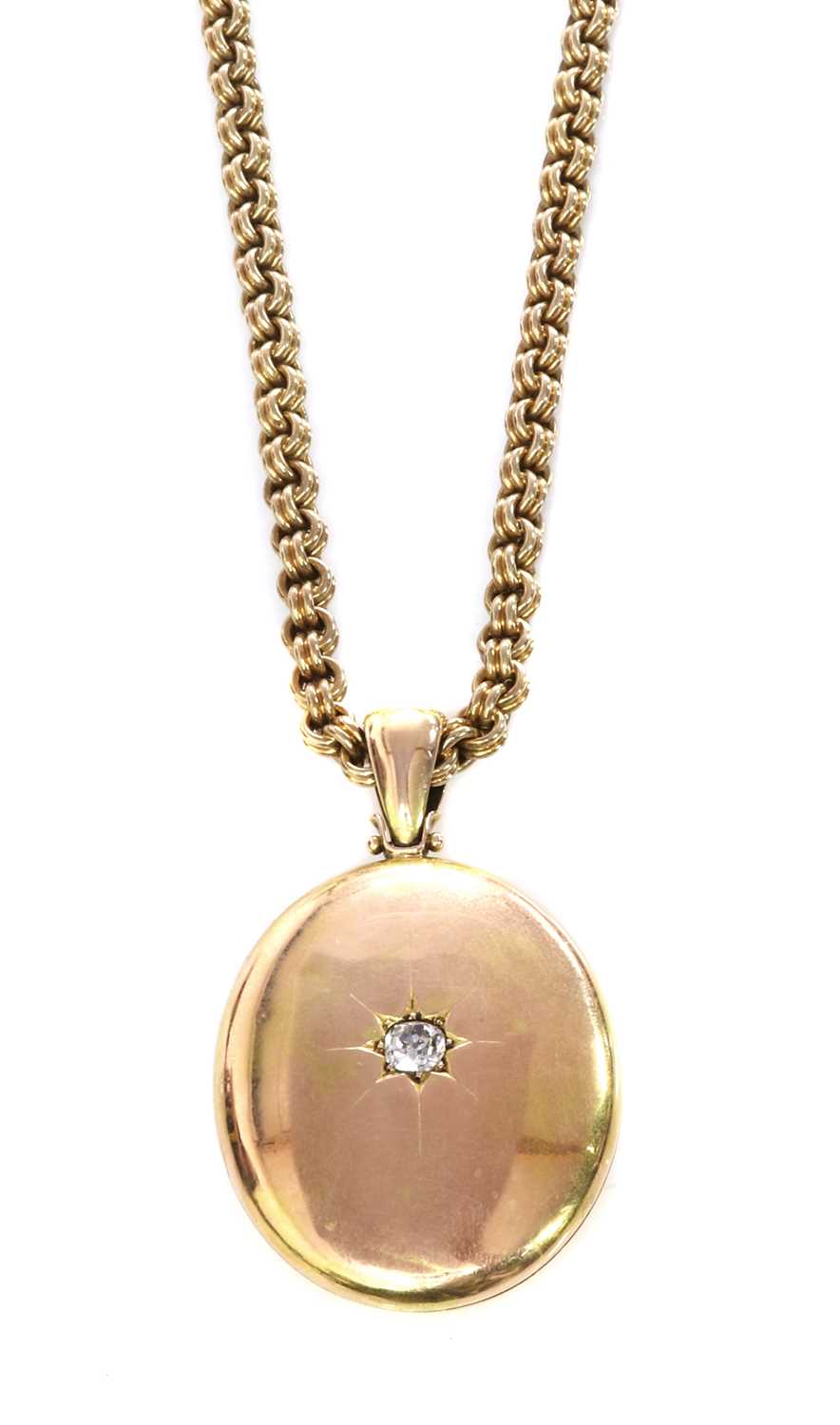 Lot 65 - A Victorian gold diamond set locket and chain