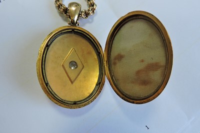 Lot 65 - A Victorian gold diamond set locket and chain
