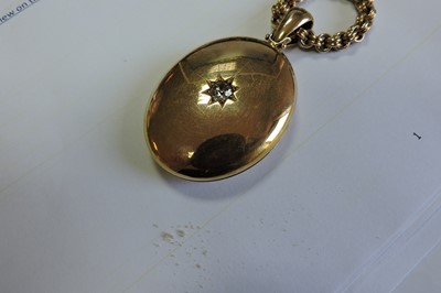Lot 65 - A Victorian gold diamond set locket and chain