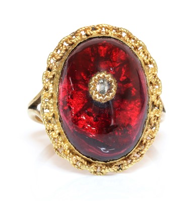 Lot 60 - A Victorian cabochon garnet and diamond later mounted as a ring