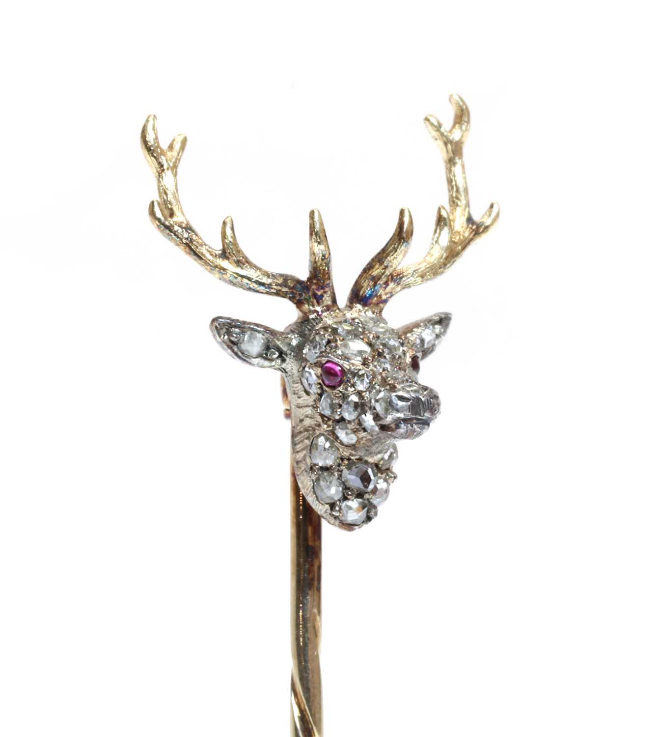Lot 94 - A diamond set stag head stick pin