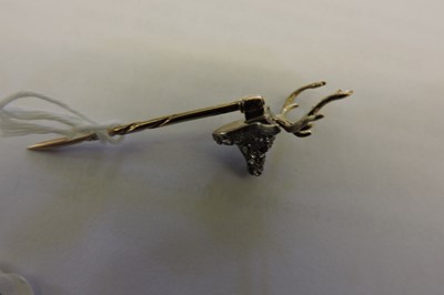 Lot 94 - A diamond set stag head stick pin