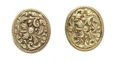 Lot 320 - A pair of oval repoussé earrings