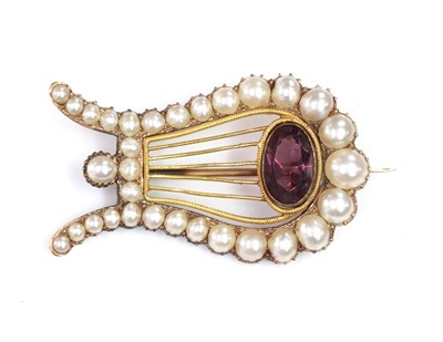 Lot 41 - A Georgian paste and split pearl lyre brooch