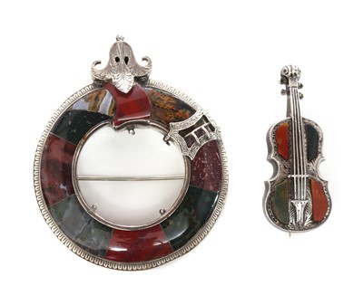 Lot 81 - A Scottish silver hardstone garter style circle brooch