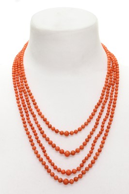 Lot 69 - A four row graduated carved coral bead necklace
