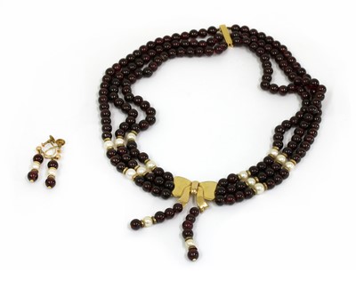 Lot 248 - A three row garnet bead and cultured pearl necklace