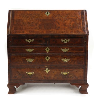 Lot 235 - A George III walnut and feather banded bureau