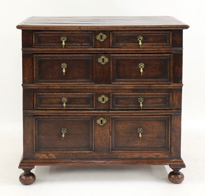 Lot 232 - An oak geometric fronted chest