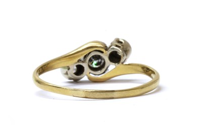 Lot 53 - A gold three stone diamond crossover ring