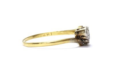 Lot 53 - A gold three stone diamond crossover ring