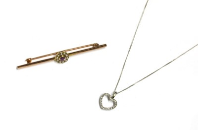 Lot 243 - A 9ct white gold diamond set heart pendant
