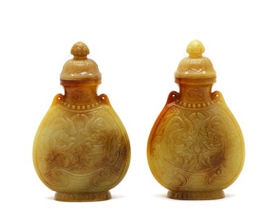 Lot 99 - A pair of Chinese jade vases and covers