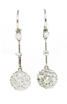 Lot 189 - A pair of diamond set daisy cluster drop earrings, c.1930