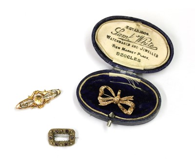 Lot 232 - Three gold brooches