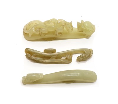 Lot 282 - Three Chinese jade belt hooks