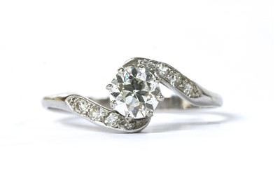 Lot 1122 - A platinum diamond crossover ring
