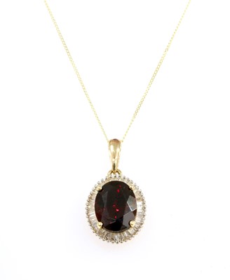 Lot 247 - A gold garnet and diamond cluster pendant