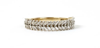 Lot 133 - A gold baguette cut diamond ring