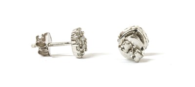Lot 170 - A pair of white gold diamond cluster earrings