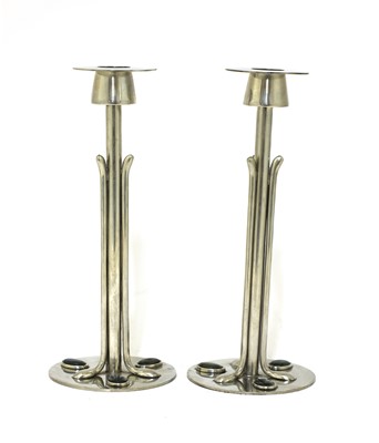 Lot 145 - A pair of Arts and Crafts pewter and abalone-mounted candlesticks