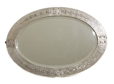 Lot 103 - An Arts and Crafts silvered copper wall mirror