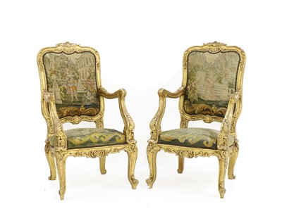 Lot 327 - A pair of French Regence-style giltwood fauteuils