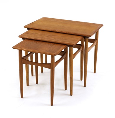 Lot 610 - A nest of teak tables