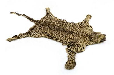 Lot 529 - An African leopard skin rug