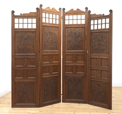 Lot 140 - An Arts and Crafts oak four-fold dressing screen