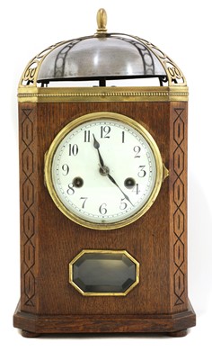 Lot 20 - An oak and brass-mounted mantel clock