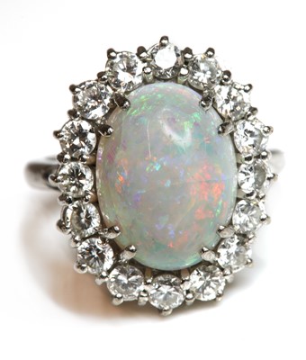 Lot 449 - A white gold opal and diamond cluster ring