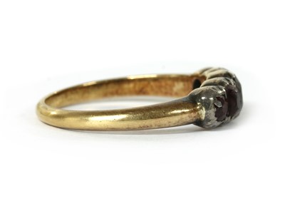 Lot 1025 - A gold and silver garnet ring
