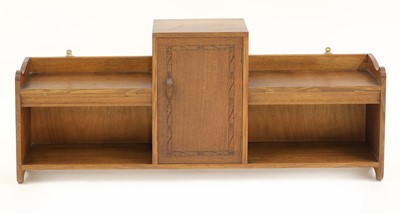 Lot 133 - An Arts and Crafts oak hanging wall cabinet