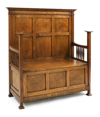 Lot 131 - An Arts and Crafts oak settle
