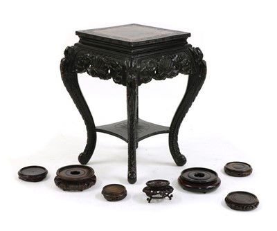 Lot 242 - A Chinese laquered wood jardinere stand
