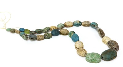 Lot 161 - A row of graduated faience Egyptian scarabs
